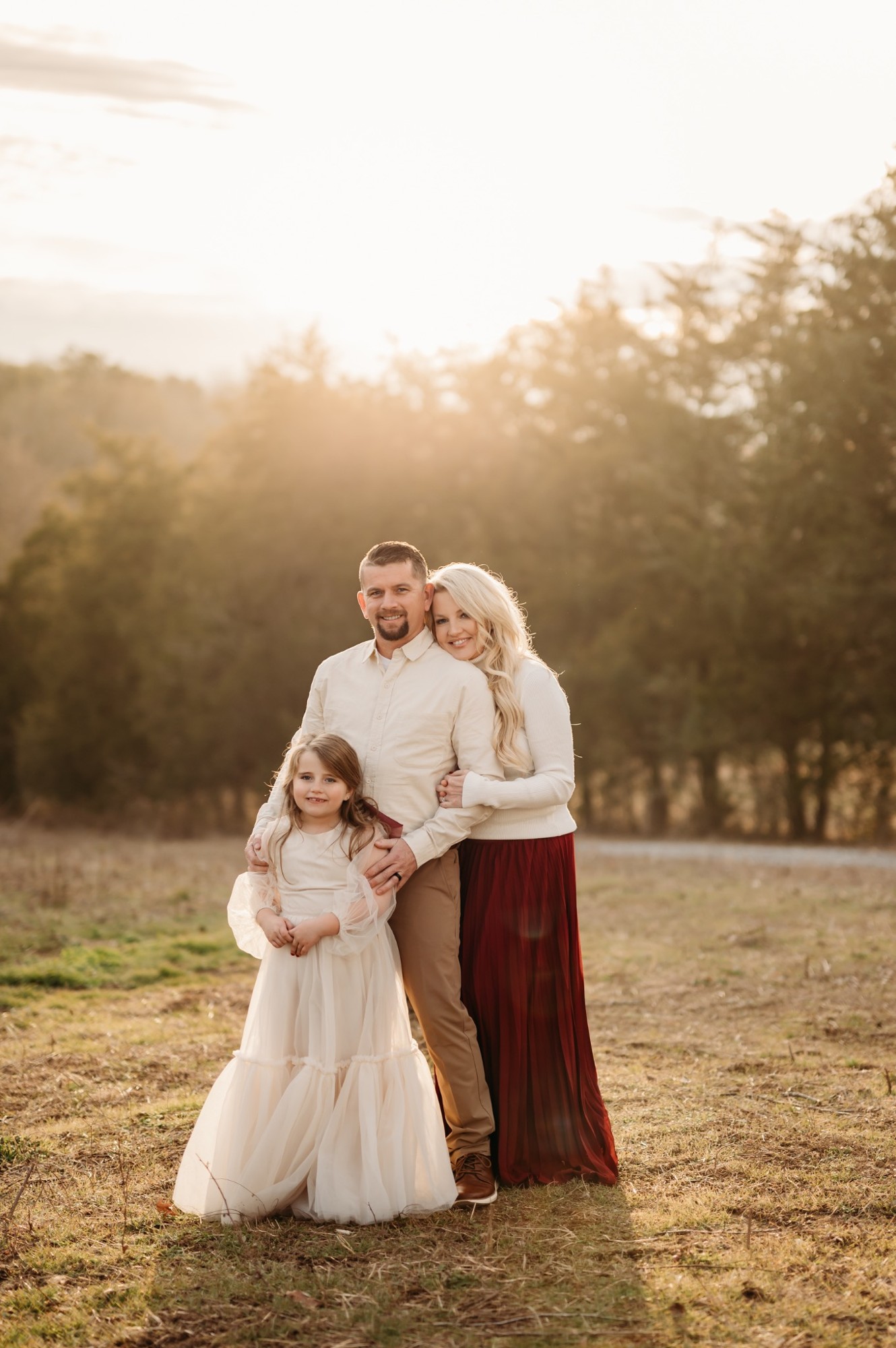Our family together in a field in warm evening light